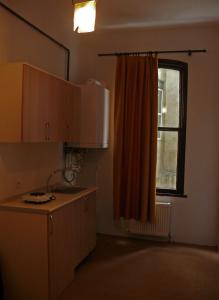 a kitchen with a sink and a window at Budak Residence in Istanbul