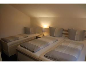 Letto o letti in una camera di Gästehaus Elzblick