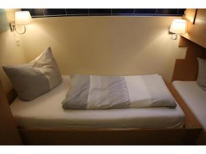 Letto o letti in una camera di Gästehaus Elzblick