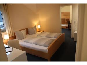 Letto o letti in una camera di Gästehaus Elzblick