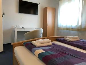 Letto o letti in una camera di Gästehaus Elzblick