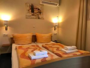 Letto o letti in una camera di Gästehaus Elzblick