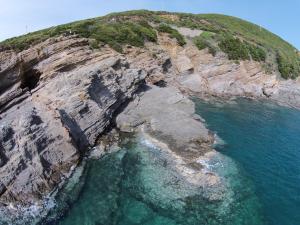 an aerial view of a rocky island in the ocean at Arpaderba B&B in Livorno