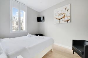 TV a/nebo společenská místnost v ubytování Le Jardin Anglais - 6p - Proche Gare