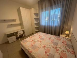 Posteľ alebo postele v izbe v ubytovaní Residence Antares - Agenzia Cocal