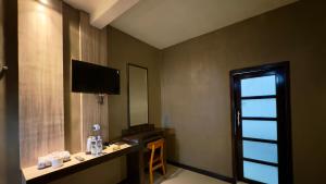 TV a/nebo společenská místnost v ubytování Sky View Bromo Guest House