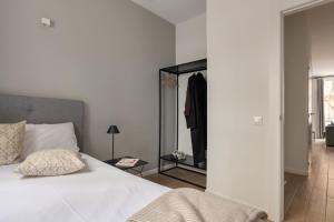 Posteľ alebo postele v izbe v ubytovaní Apartamentos Líbere Valencia Abastos