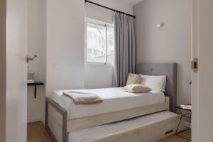 Posteľ alebo postele v izbe v ubytovaní Apartamentos Líbere Valencia Abastos