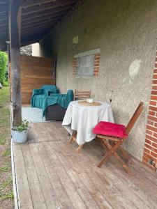 a table and two chairs on a patio at Bulle d'évasion in Belleville-sur-Loire