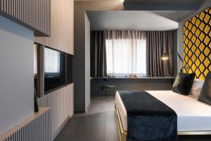 Postel nebo postele na pokoji v ubytování Catania Smart Hotel