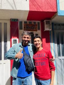 two men are standing in front of a building at Bogotá Kings 302A in Bogotá