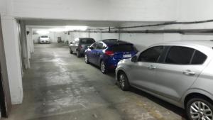 a parking garage with cars parked in it at Depto 2 amb zona centro con cochera Solo familias in Mar del Plata