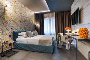 Postel nebo postele na pokoji v ubytování Catania Smart Hotel