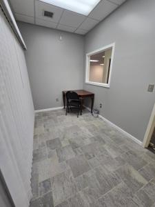 an empty room with a table and a chair at Spooky Nook Bed and Breakfast in Manheim +41 photos