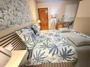 Postel nebo postele na pokoji v ubytování Auberge Desprairies