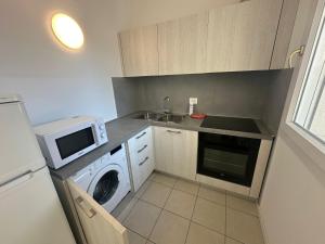 Kuchyňa alebo kuchynka v ubytovaní Residence Antares - Agenzia Cocal