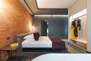 Postel nebo postele na pokoji v ubytování Catania Smart Hotel