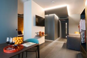 TV a/nebo společenská místnost v ubytování Catania Smart Hotel