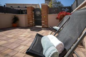 a person laying on a swing in front of a house at Ferienhaus Mit Whirlpool Und Sauna, In Kastelir in Kaštelir +32 photos