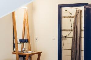 a bathroom with a sink and a mirror at De Zwarte Stok in Riemst +99 photos