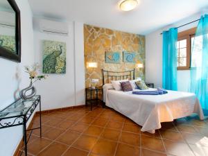 Ein Bett oder Betten in einem Zimmer der Unterkunft Holiday Home Tres Palmeras by Interhome