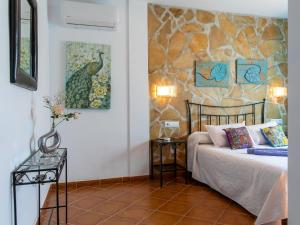 Ein Bett oder Betten in einem Zimmer der Unterkunft Holiday Home Tres Palmeras by Interhome