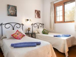 Ein Bett oder Betten in einem Zimmer der Unterkunft Holiday Home Tres Palmeras by Interhome