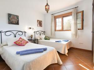 Ein Bett oder Betten in einem Zimmer der Unterkunft Holiday Home Tres Palmeras by Interhome