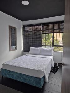 Postel nebo postele na pokoji v ubytování Hotel Capital
