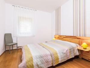 A bed or beds in a room at Holiday Home Horvath by Interhome