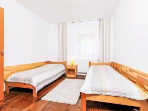 A bed or beds in a room at Holiday Home Horvath by Interhome