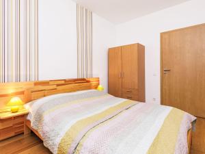 A bed or beds in a room at Holiday Home Horvath by Interhome