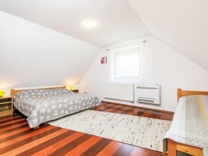 A bed or beds in a room at Holiday Home Horvath by Interhome