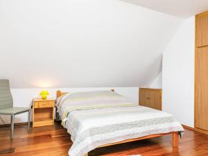 A bed or beds in a room at Holiday Home Horvath by Interhome