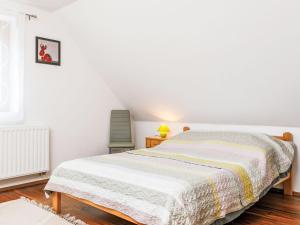 A bed or beds in a room at Holiday Home Horvath by Interhome