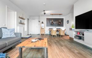 a living room with a couch and a table at Slessmynna in Kappeln
