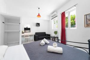 Posteľ alebo postele v izbe v ubytovaní Islanders Yard Apartments