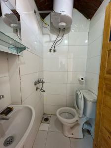 a bathroom with a toilet and a sink and a tub at Nubian King in Aswan +37 photos