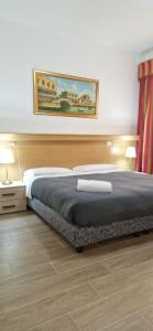 Postel nebo postele na pokoji v ubytování Hotel Tito