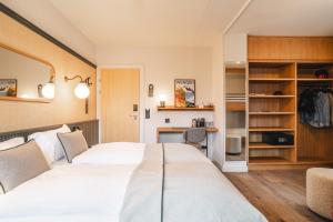Braunbär Hotel & Spa - Former Alpine Sunstar Hotel客房内的一张或多张床位