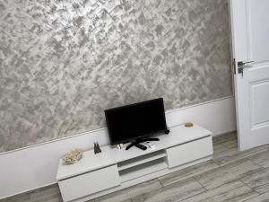 Μια τηλεόραση ή/και κέντρο ψυχαγωγίας στο Apartament de inchiriat +5 φωτογραφίες