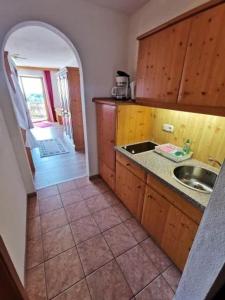 a kitchen with a sink and a counter top at Wohnungen In Traumlage Bei Sankt Englmar in Hilm