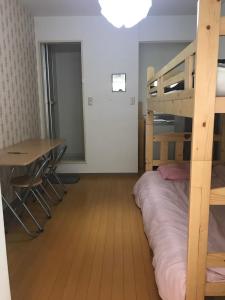 Postel nebo postele na pokoji v ubytování 新宿東京暖房 + 10 fotografií