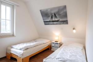 Postel nebo postele na pokoji v ubytování Ferienhaus Jaguar + 17 fotografií