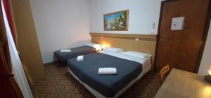 Postel nebo postele na pokoji v ubytování Hotel Tito