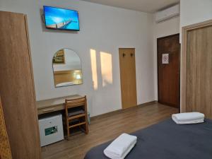 Postel nebo postele na pokoji v ubytování Hotel Tito