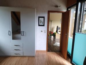 a hallway with a door leading to a room at Paradies Hoffmann in Bad Lauterberg
