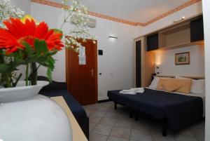Postelja oz. postelje v sobi nastanitve Hotel Ambasciata