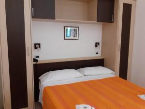 Postelja oz. postelje v sobi nastanitve Hotel Ambasciata