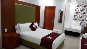 Letto o letti in una camera di Alec's Hotel